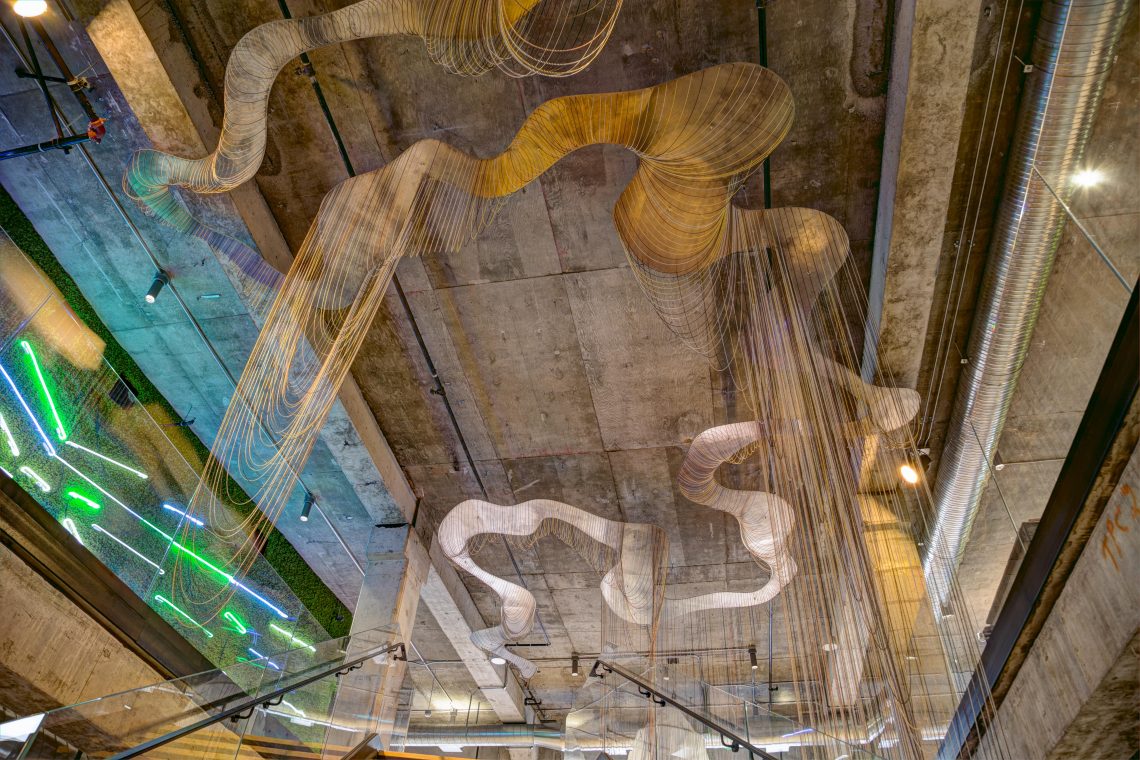 California Water Rights, 2018, aluminum and ball chain, Adrien Segal. A data-based sculptural installation in a building in downtown San Francisco, California. Photo credit: Austin Dickenson.