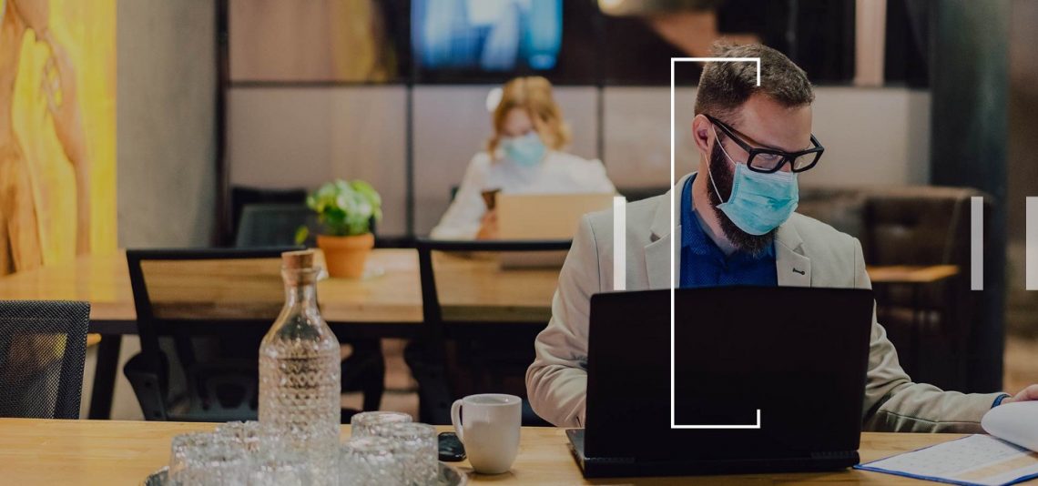 Masked employee at work