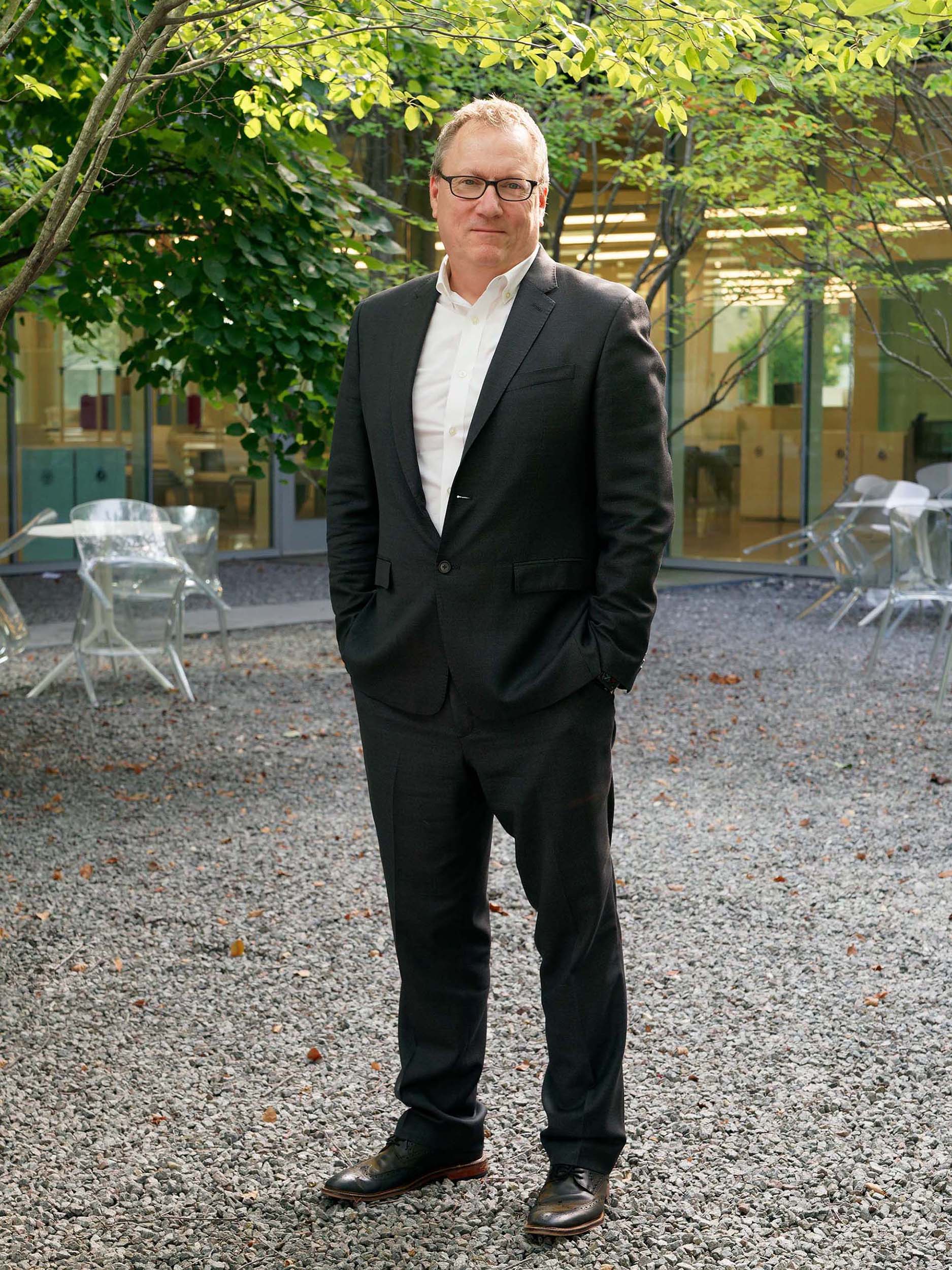Peter Zapf stands in the ID outside courtyard