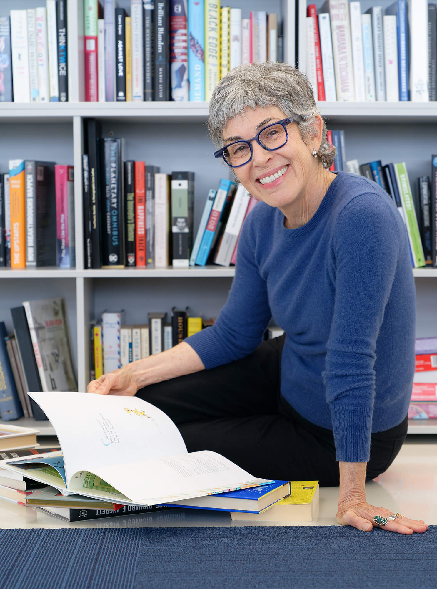 Sari Gluckin sitting looking at a book
