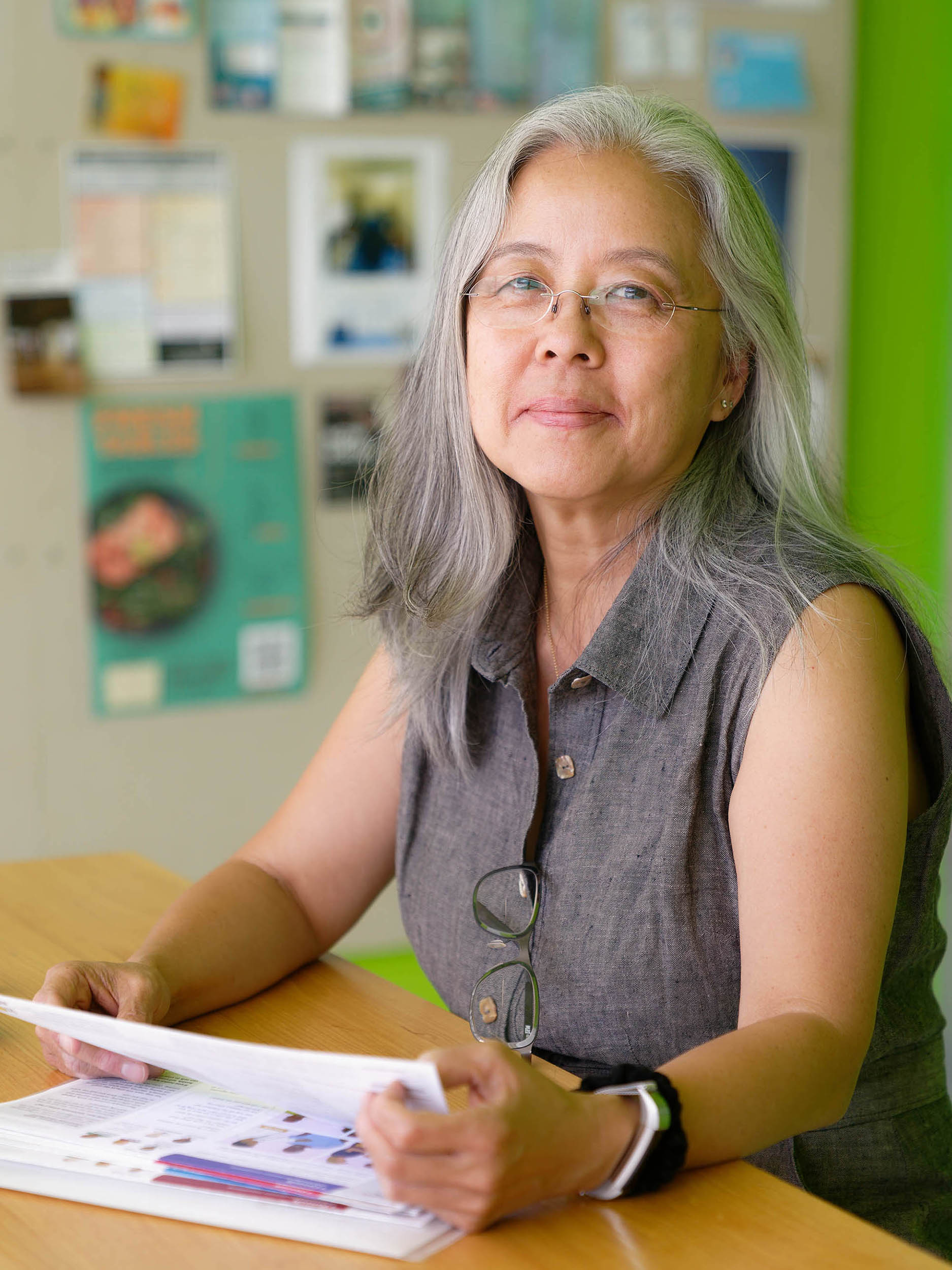 Tomoko Ichikawa sits at a table in the ID kitchen