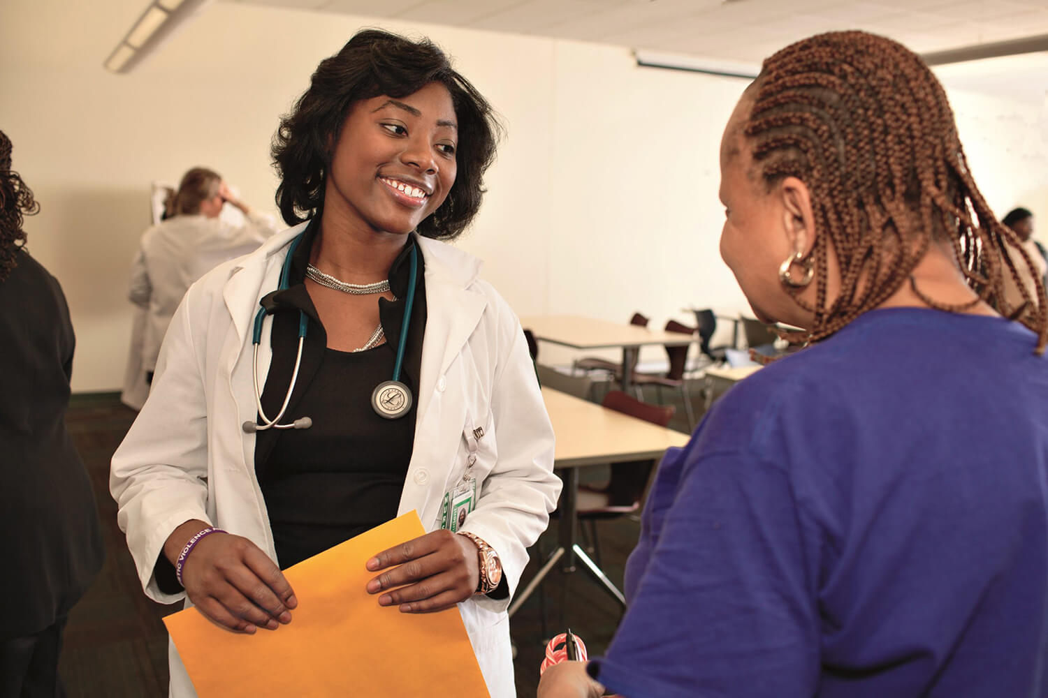 Nurse speaking to a member of the public