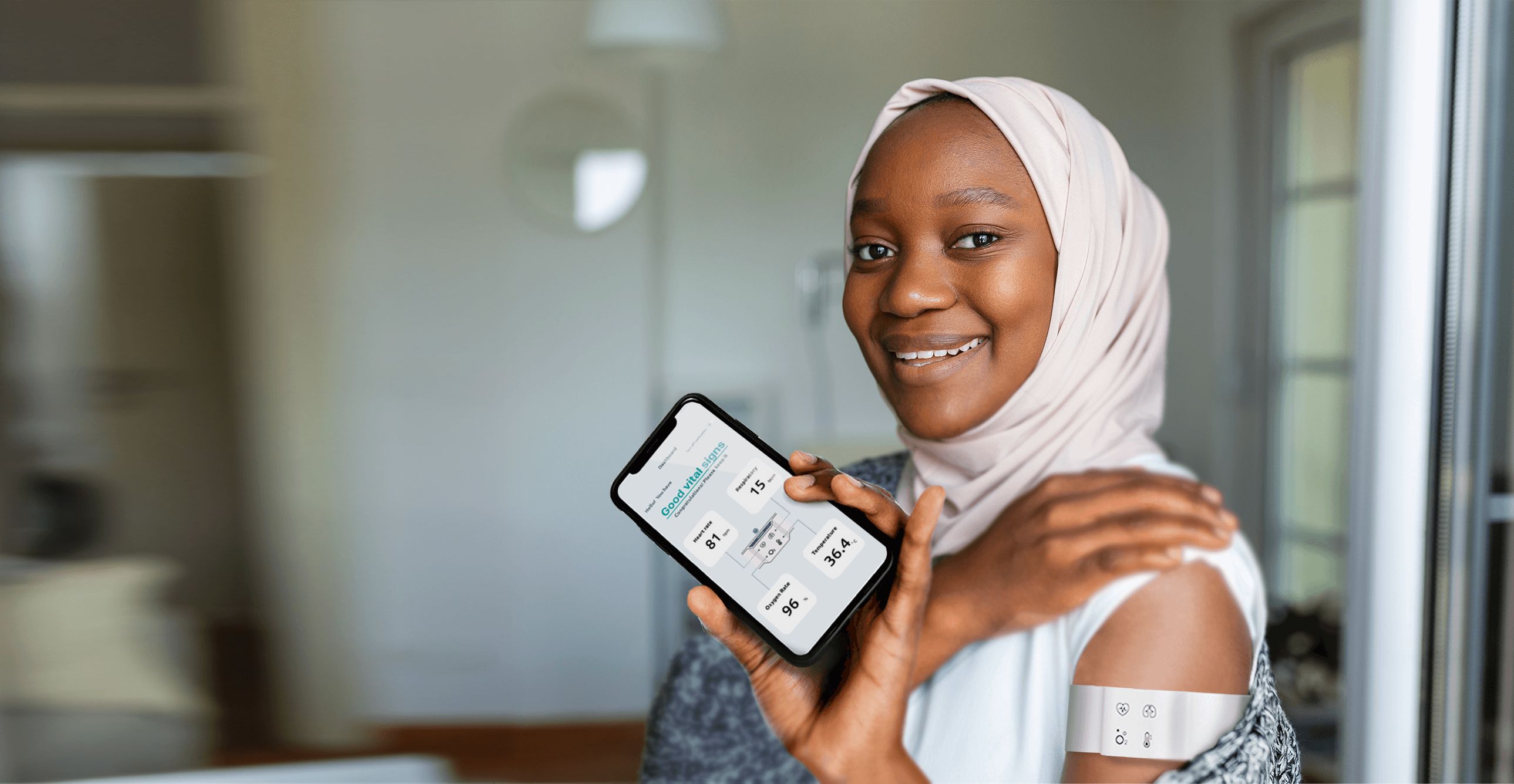 Woman wearing a medical device and holding up a cell phone
